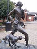 Bronze of runner facing right with og by sidde