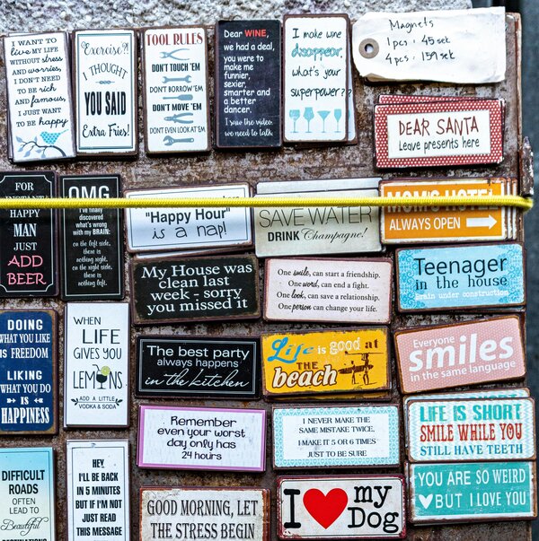 Display of fridge magnets on blueish backgroun