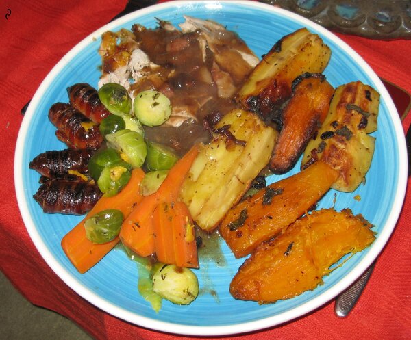 Blue plate with sprouts, sweet potato, other egetables an fish