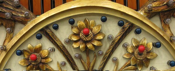 Fairground art. Photo (c) J..G. Betts Decorative carved flowers on old fairground ride