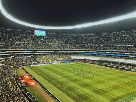 Aerial view of interior of Azteca Stadium with game in progress